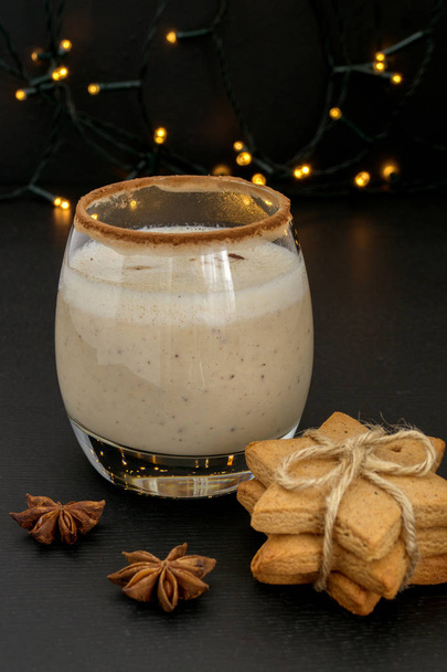 Cocktail eggnog and cookies are the stars on the background ligh - Photo, Image