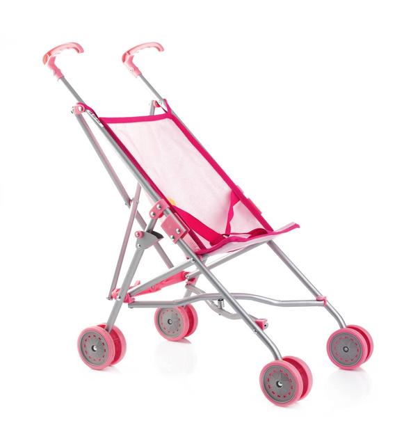 Little pink baby carriage or doll stroller isolated on white - Valokuva, kuva