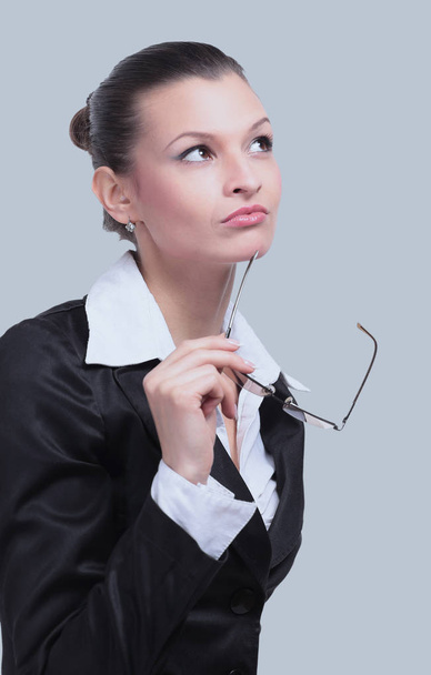 Thoughtful business woman looking confident . Isolated on gray - Foto, afbeelding