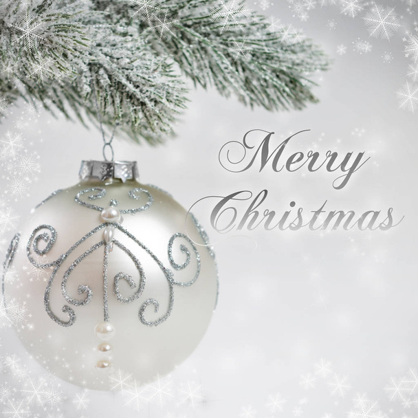Silver-gray Christmas card with shiny bauble - Foto, Imagen