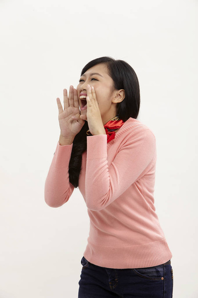 asian woman shouting on the white background - Photo, Image