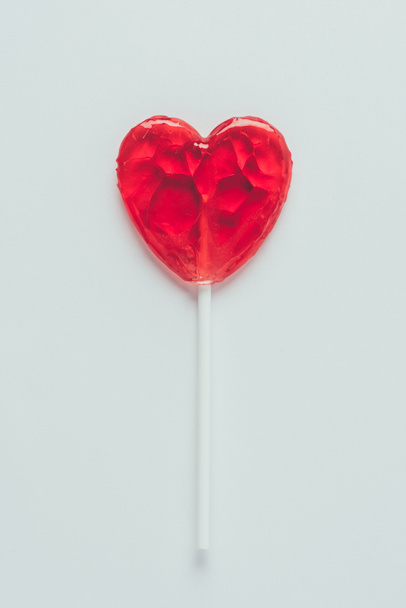top view of heart shaped lollipop isolated on white, valentines day concept - Photo, Image