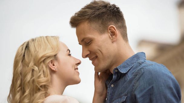 Couple in love looking at each other, romantic date, tender feelings, close-up - Fotografie, Obrázek