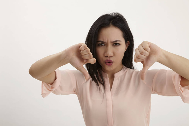 malay woman angry with thumb's down - Photo, image