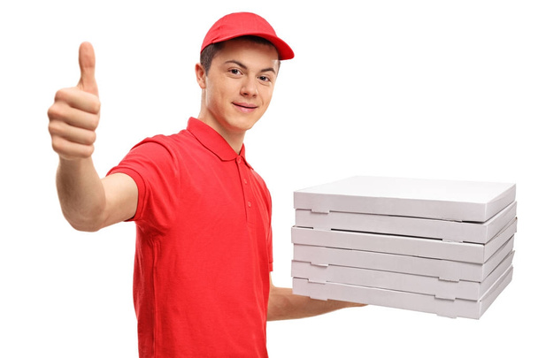 pizza delivery boy making a thumb up sign - Фото, изображение