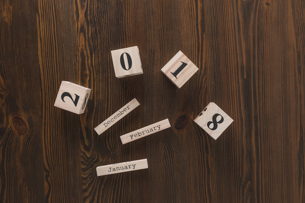 top view of parts of wooden calendar on dark wooden tabletop - Photo, Image