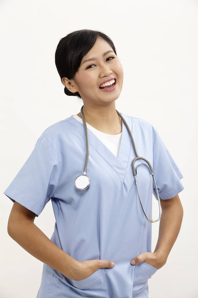female nurse with blue uniform on the white background - Photo, image