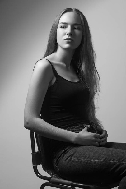 Portrait of proud  woman, looking looking at camera. Studio shot, isolated on gray background - Valokuva, kuva