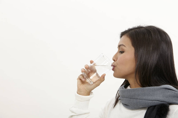 malay woman holding a glass of water - Photo, Image