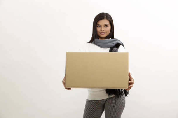 asian woman holding brown cardboard box - Photo, image