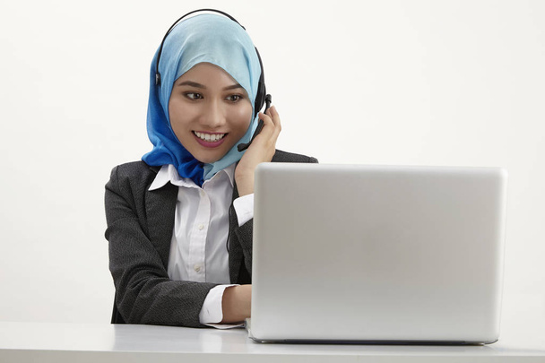 malay  receptionist wearing  tudung posing on white background  - Foto, immagini