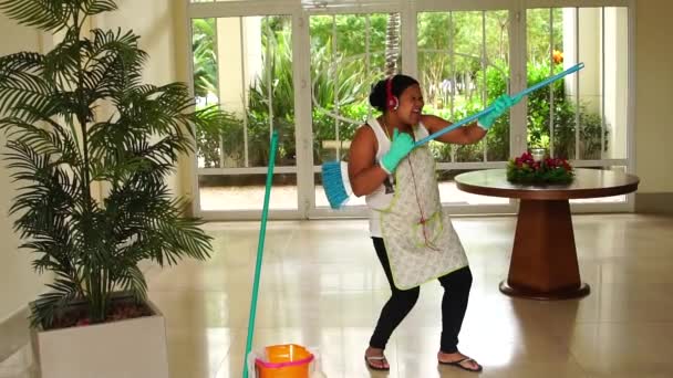 Funny Housekeeper Dancing and Having Fun With Broom - Footage, Video