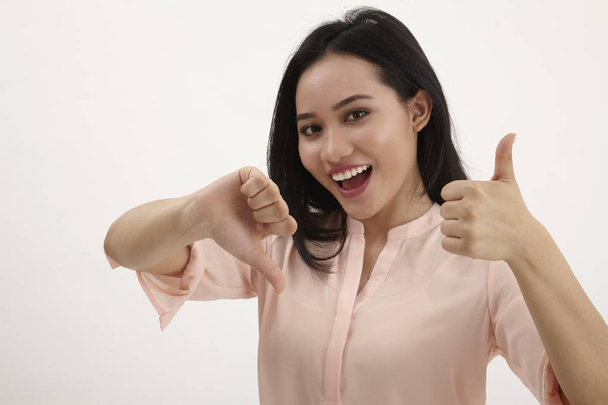  portrait of beautiful young success woman giving thumbs up standing in full length on white background - Foto, immagini