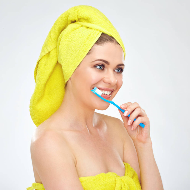 smiling woman wearing towels cleaning teeth with toothy brush, Healthy teeth concept - Фото, изображение