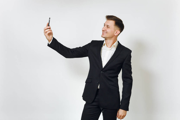 Young smiling successful handsome business man in black suit doi - Fotografie, Obrázek