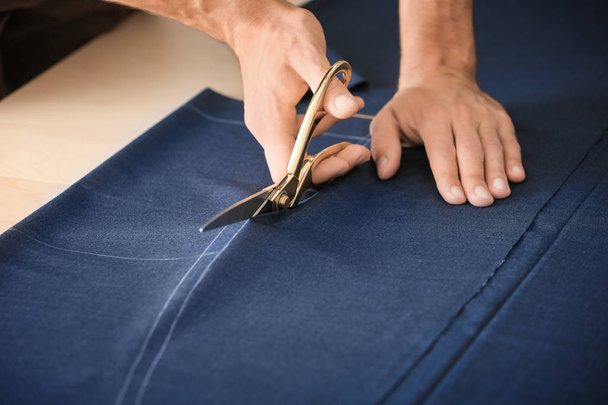 Young tailor working with textile, closeup - Zdjęcie, obraz