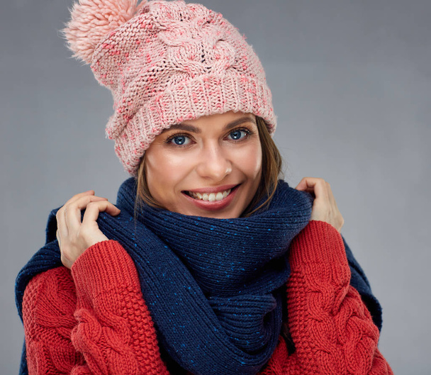 Close up face portrait of smiling woman wearing winter warm clot - 写真・画像