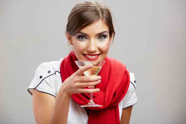 smiling woman wearing red scarf holding alcohol cocktail drink glass  - Φωτογραφία, εικόνα