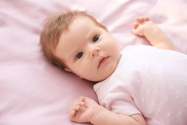 Cute little baby lying on bed at home - Foto, Imagem