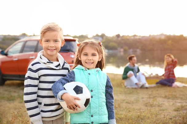 Cute children with ball, outdoors - Zdjęcie, obraz