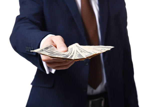 Man in formal suit holding money on white background, closeup - Fotografie, Obrázek