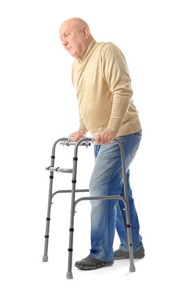 Elderly man with walking frame on white background - Φωτογραφία, εικόνα