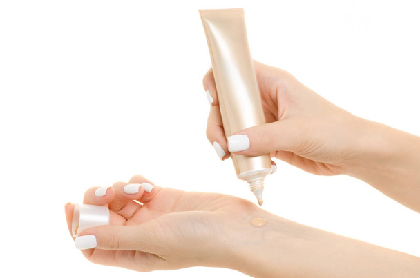 Female hand base cream beige - Foto, afbeelding