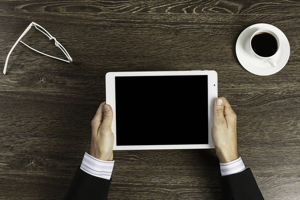 Tablet PC con pantalla en blanco en las manos
 - Foto, Imagen