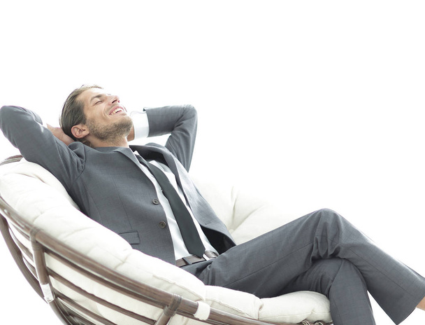 happy businessman relaxing in big comfortable armchair - Foto, afbeelding