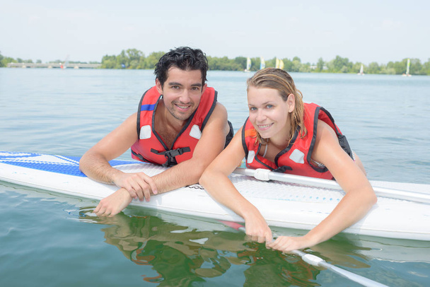 couple paddling on vacation - Photo, Image