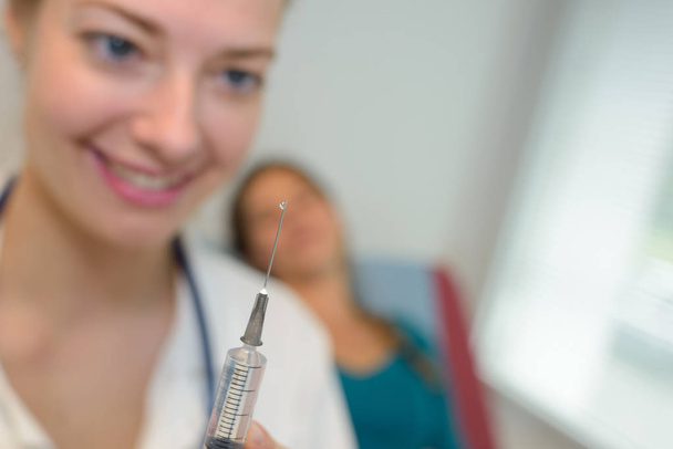 closeup of a female doctor with syringe - Zdjęcie, obraz
