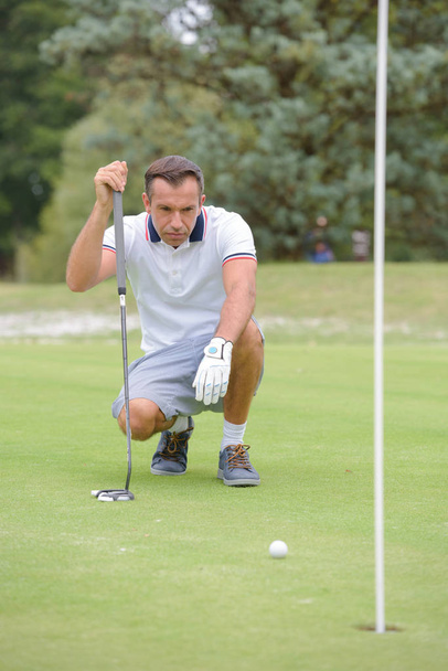 Golfer assessing next shot - Fotó, kép