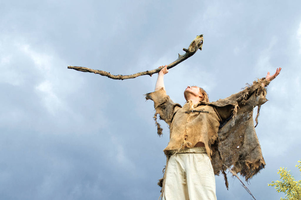 druid causes the rain raising his staff to the heavens - Photo, image