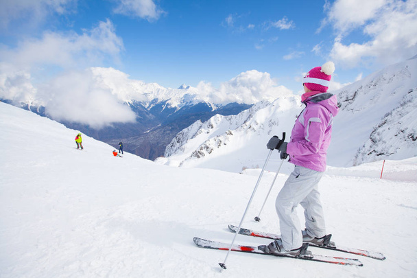 woman skiing  in the mountains - 写真・画像
