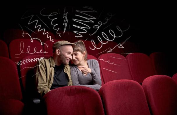 Cute couple in cinema watching movie  - Photo, image