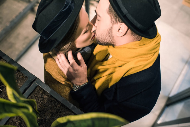 young attractive couple kissing in autumn outfit - Photo, Image