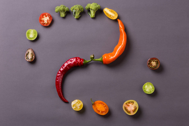 Chilli peppers with tomatoes and broccoli on grey background - Foto, immagini