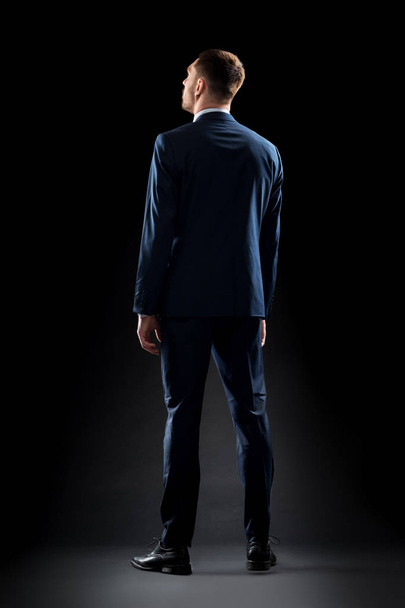 businessman in suit over black - Foto, Imagem