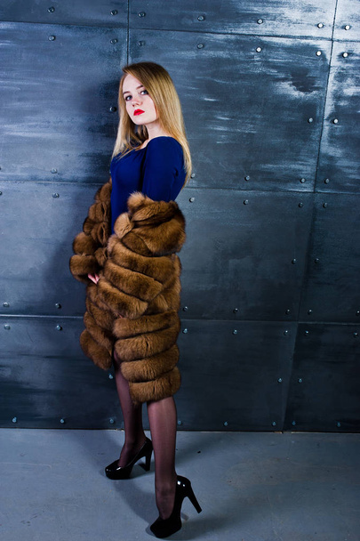 Elegante blonde girl wear on fur coat and combi dress posed agai - Fotoğraf, Görsel