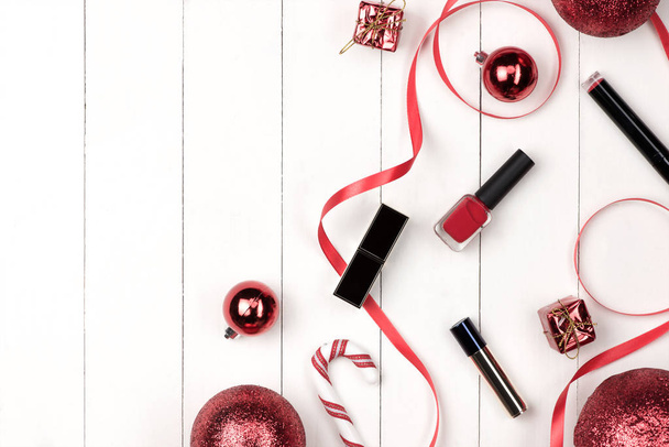 Flat lay of christmas ball, gift and cosmetic. Holiday Background. Beauty concept. - Fotoğraf, Görsel