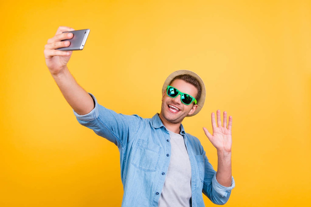 Stylish, cheerful, bearded guy in casual outfit  taking a pictur - Fotó, kép