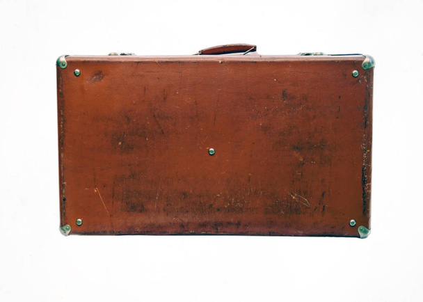 Standing at an angle leather old suitcase isolated on white back - Zdjęcie, obraz
