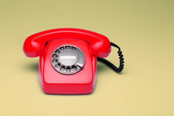 Red telephone in retro style. - Foto, afbeelding