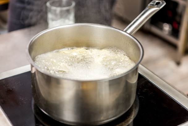 https://cdn.create.vista.com/api/media/small/177187212/stock-photo-pasta-boiling-water-pot-electric-stove