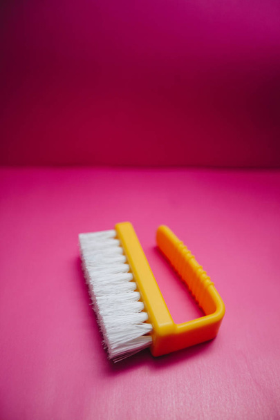 Yellow plastic clothes brush - Foto, Imagen