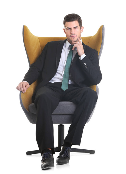 man sitting in armchair  - Foto, imagen
