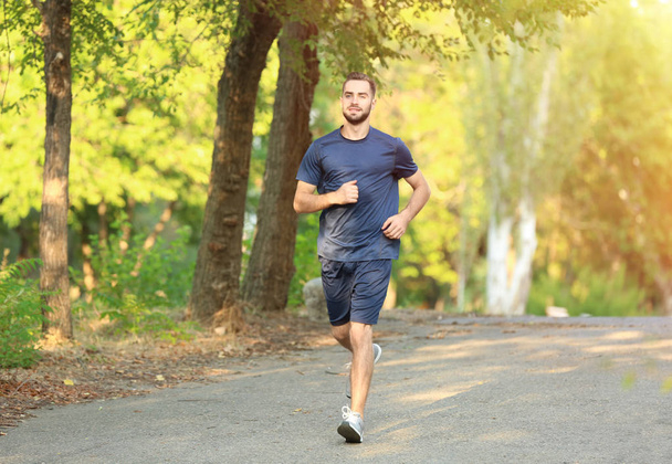 Sporty young man running - 写真・画像