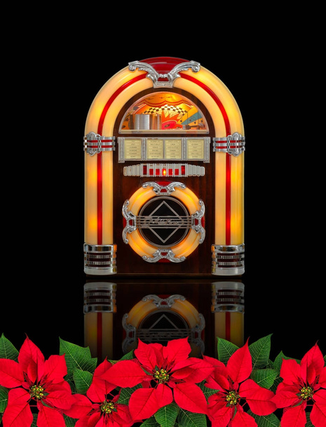 Juke rádio caixa com vermelho Poinsettia flor enfeite de Natal
 - Foto, Imagem