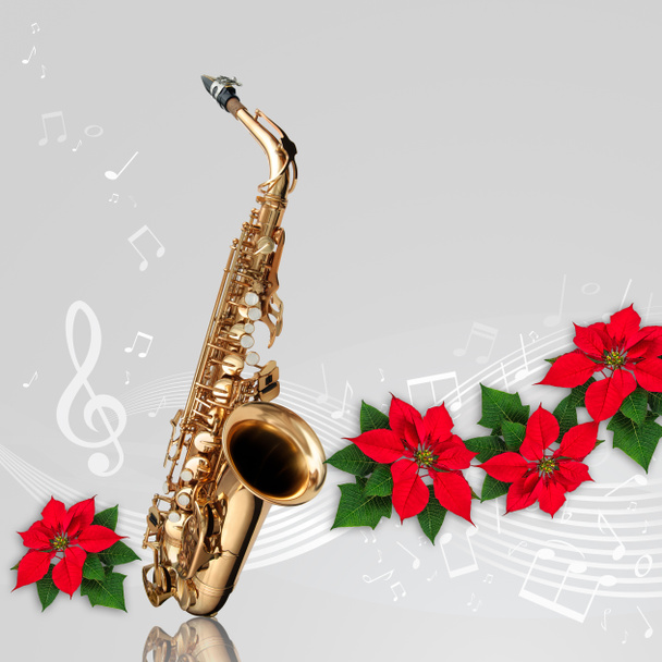 Saxophone with Red Poinsettia flower christmas ornament - Photo, Image