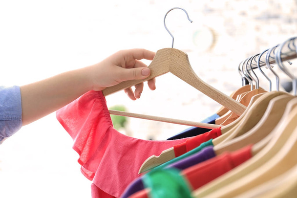 Young woman choosing clothes  - Foto, Imagem